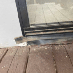 Cladding missing under door